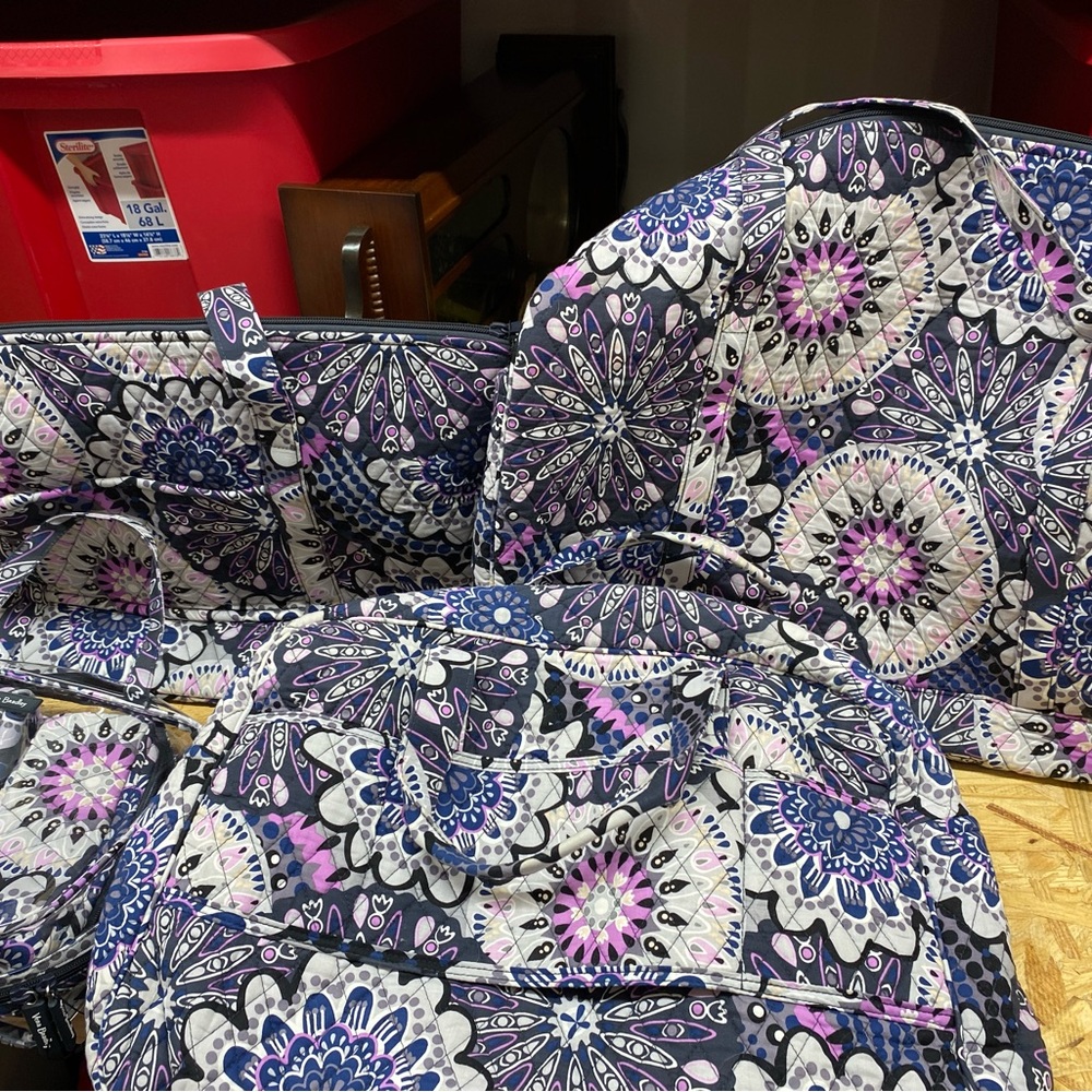 Vera Bradley mimosa medallion purses. They are all brand new.